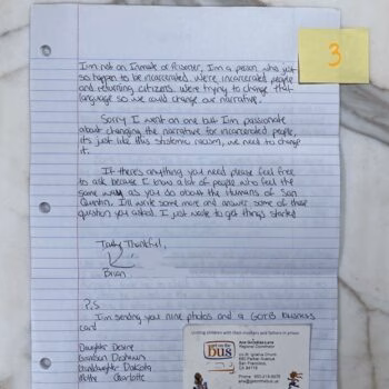 Handwritten letter on lined paper discussing incarceration, signed by Brian, with a yellow sticky note and a business card for 'Get on the Bus' attached.