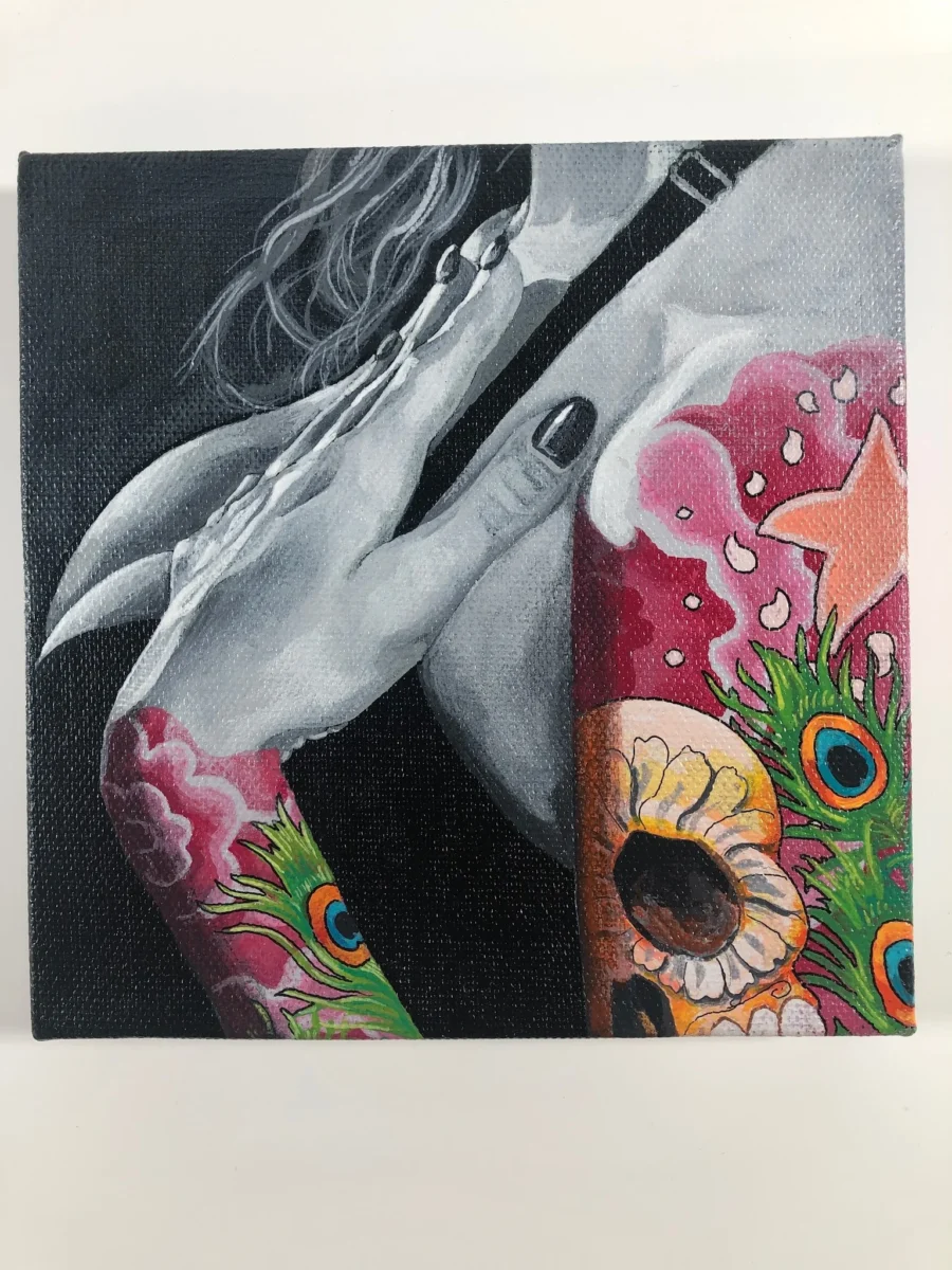 A close-up painting focusing on shoulders and arms adorned with vibrant tattoos, including a sugar skull, peacock feathers, pink floral patterns, and a star, alongside a pale hand with dark nail polish.