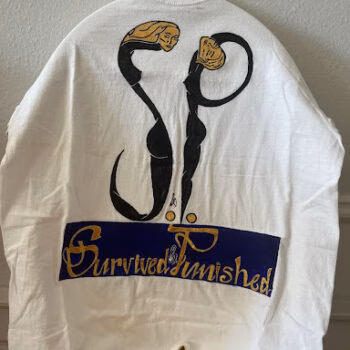 A white long-sleeved shirt featuring a large black and gold graphic of two stylized figures holding hands, with the text 'Survived Punished' in a gold script font on a blue banner below.