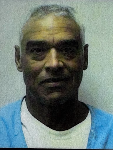Pedro, a man with short grey hair, looking directly at the camera.