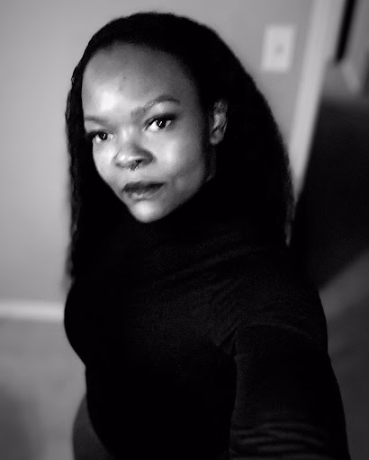 Portrait of Woman Black and white portrait of a woman with long dark hair looking directly at the camera.