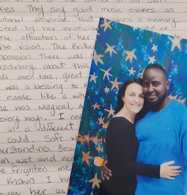 A couple embracing in front of a starry blue mural, with handwritten journal text in the background.