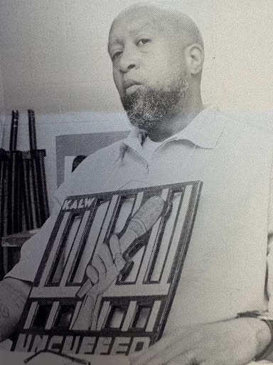 A black and white portrait of Brian wearing a t-shirt with a graphic of a hand holding a microphone behind bars, with the text 'KALW' and 'UNCUEBED'.