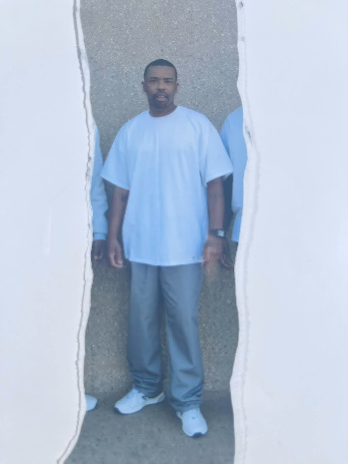 Antwann 5:1:24 stands in a light blue t-shirt and grey pants, framed by a torn paper effect.