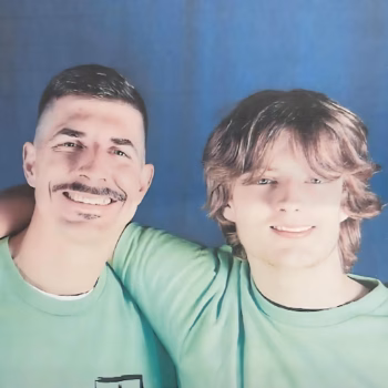 Lucas, 38, and a younger man in matching green shirts smiling together against a blue background.