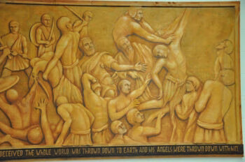 A large, golden-hued relief mural depicting a chaotic biblical scene of figures in distress and conflict, with a caption at the bottom.