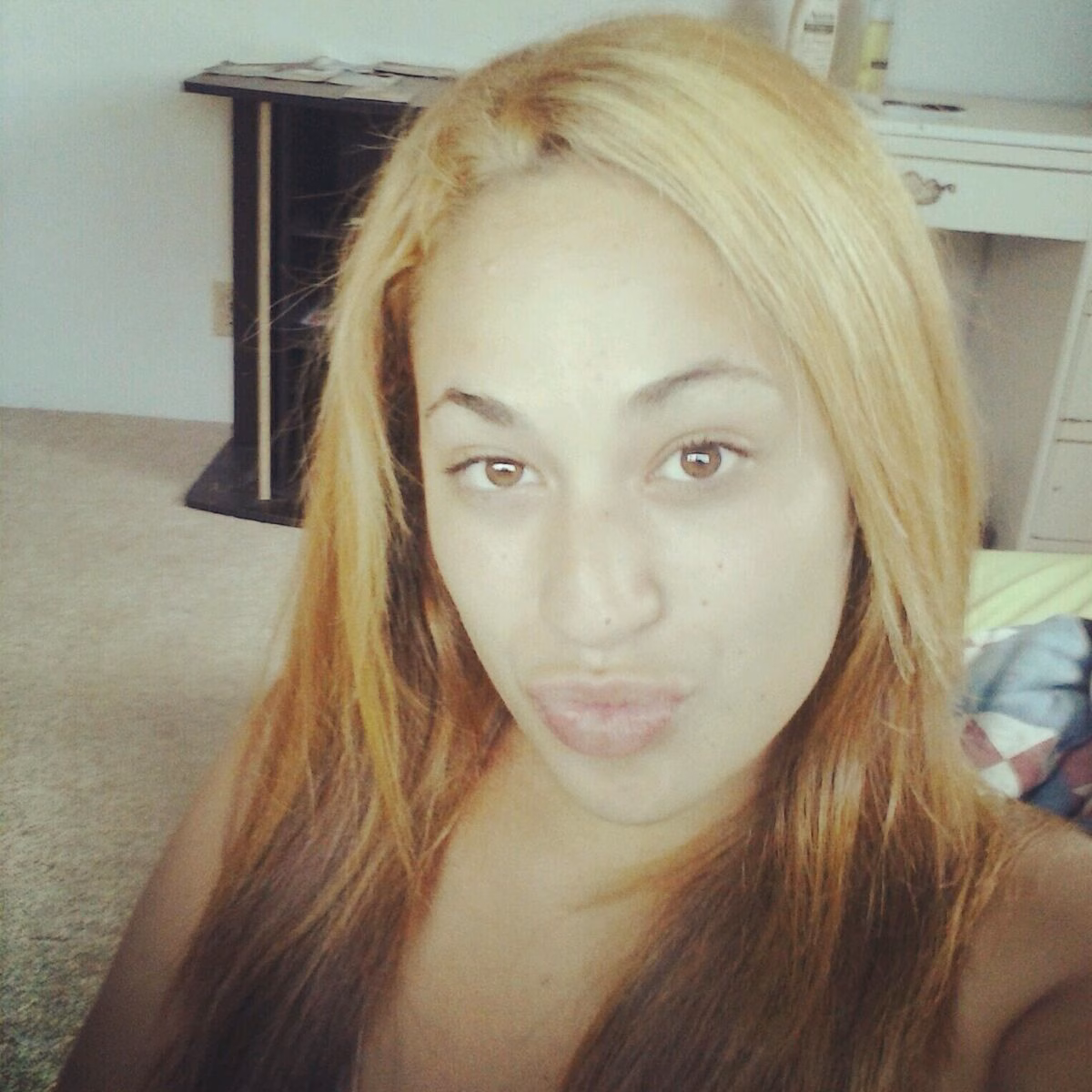 460846308_3235976056535470_368818544710036949_n A young woman with long blonde hair looks directly at the camera in a selfie.