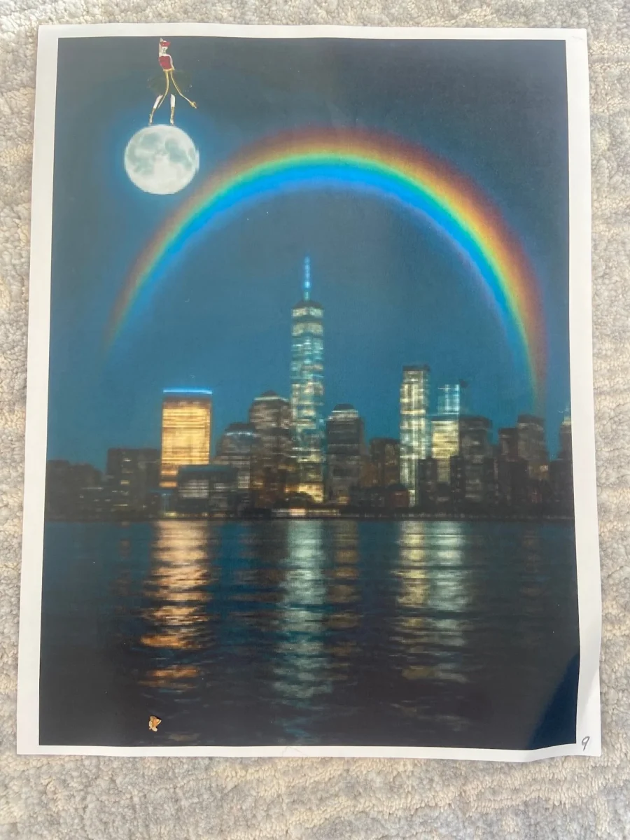 A surreal image of the New York City skyline and reflecting water at night, featuring a bright rainbow arching over the buildings and a full moon in the upper left corner with a small, stylized figure standing on top of it