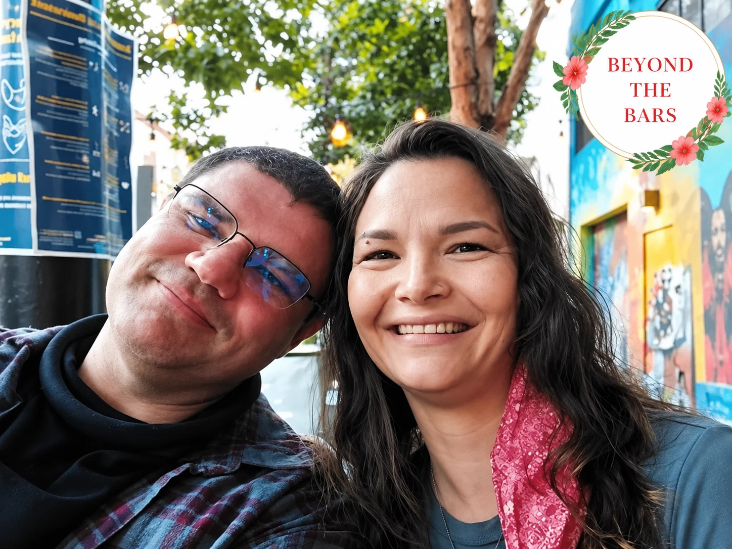Joe Krauter and a woman smiling together outdoors.