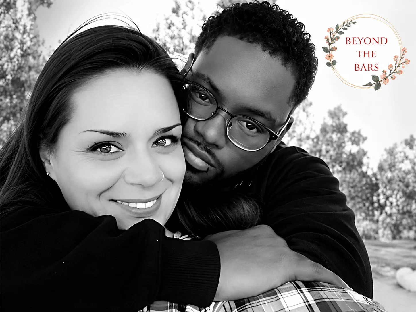 Quincy Paige, 8 years inside 3 Black and white selfie of Quincy Paige and a man embracing, with a heart-shaped light reflection on her face.